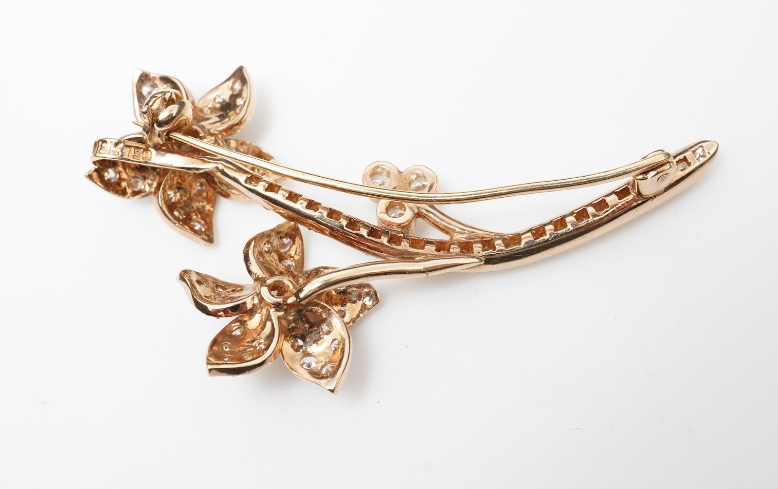 A gold and diamond brooch